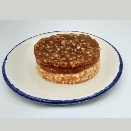 Timbal de queso de cabra con papaya, tomate de pera confitado y almendras